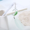 Creative white gel pen with moon pendant, green sequins, and feather charm for students - White