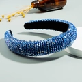 Padded blue crystal headband featuring hand-beaded sparkling rhinestones on a thick band - Sapphire Blue