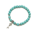 Detailed top view of turquoise beaded bracelet with silver key heart pendant and carvings - Key