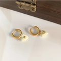 Golden hoop earrings with cream enamel heart charms and small gold center heart detail - Hoop Earrings / Creamy White Heart