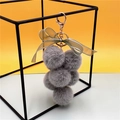 Gray plush grape keychain with a green organza bow and golden metal lobster clasp - Gray