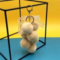 Cute beige faux fur grape keychain with white lace bow and golden metal ring - Beige