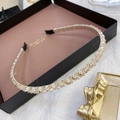 Detail of thin champagne gold metal headband with sparkling crystals and beads - Twisted White