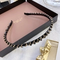 Close-up of black faceted beads and gold metal beads hand-wound on a thin headband - Twisted Black
