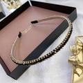 Detailed close-up of a slim metal headband with black and gold crystal bead decoration - Plain Black