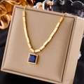 Minimalist gold titanium necklace with blue square pendant on a beige jewelry box - Blue Square Pendant Necklace (N1787)