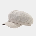 Détail d'une casquette gavroche vintage en tweed beige de style britannique élégant - Beige