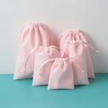 Pink velvet drawstring jewelry pouches in multiple sizes for gift packaging and storage - Pink