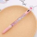 Schattige roze glitter gelpen met kattenpoot topper op een beige keramiek bord - Wit