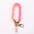Portachiavi in resina sfumata rosa-arancio con chiusura dorata e nappa in pelle chic - Rosa e Rosa Nude
