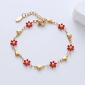 Detail of lobster clasp and floral heart charms on 18k gold plated stainless steel bracelet - Red Flower