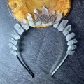 Detailed shot of bohemian raw crystal crown with silver moon on a dark stone surface - Clear White Crystal + Silver Moon