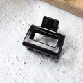 Glossy black square hollow hair claw clip with a sleek modern design on stone background - 5cm / Bright Black