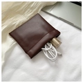 Minimalist dark brown leather mini pouch showing interior storage for USB cables - Large / Coffee