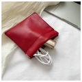 Mini red leather pouch with spring closure holding a white cable and gold accessory - Large / Red