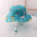 Teal green kids bucket hat with giraffe print and adjustable white windproof chin strap - EU 48 / Greenish Blue Lion