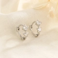 Squisiti orecchini huggie in argento 925 con ciondolo a stella in zircone per donna - Argento