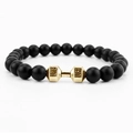 Detailed close-up of matte black beads with a golden dumbbell featuring LIFT engraving - Black Matte Gold