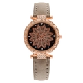 Rose gold starry watch featuring a rotating flower dial and a grey suede leather strap - Gray