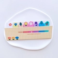 Floral sticky notes set featuring 8 distinct plant and daisy patterns in a grid holder - Yellow Plaid