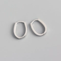 Close-up of minimalist S925 sterling silver U-shaped hoop earrings with polished finish - 925 Silver / White Gold