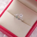 Detailed view of floral ring with resin petals and blue crystals on velvet - 14#14122B (Silver Fresh Floral Butterfly)