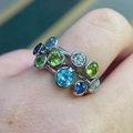 Modern silver multi-gemstone ring with green blue and clear stones on finger - US 6 / White Gold