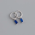 Detail view of silver hoop earrings featuring blue rectangular gemstone pendants - Rectangular Blue Rhinestone Earrings (S-E1537) / Silver