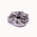 Detailed close-up of a silver-grey satin scrunchie with smooth texture and soft pleats - Silver Gray