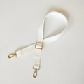 Detail of adjustable white canvas strap with polished gold-tone metal lobster clasps - Silver Hook / White