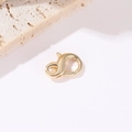 Detailed macro view of 14k gold-plated heart lobster clasps for DIY jewelry making - 14K Gold Round Lobster Clasp H-9181