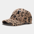 Detail of vintage newspaper print on khaki faux suede baseball cap with curved brim - Adjustable / Khaki