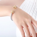 Silver twisted cable bracelet with gold accents, white diamonds and purple center stone - Z235-Purple Zirconia Double Layer