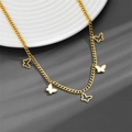 Detail of gold butterfly necklace with mother of pearl inlays and delicate chain - Butterfly Necklace A602