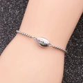 Detailed close-up of a silver stainless steel shell bracelet with colorful gemstones - Multi-color Zirconia Shell B