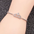 Detail of adjustable silver crown bracelet with pavé cubic zirconia on model arm - Crown 1-Bead Chain