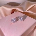 Elegant silver zircon earring set displayed on luxury marble gift box and silk fabric - Square Halo Studs