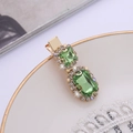 Fermaglio per capelli oro vintage con grandi strass verdi e cristalli su piatto - verde chiaro