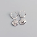 Macro shot of silver evil eye hoop earrings with sparkling crystal center detail - 925 Silver / White Gold (Pair)