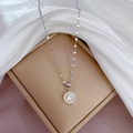 Detailed view of silver titanium necklace with Roman numeral pendant and crystal inlay - Silver
