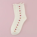 Mid-calf cream socks with vertical red heart and beige dot patterns on pink background - Side Heart / Off White