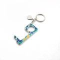 Detailed macro view of an L-shaped acrylic hygiene keychain with tropical floral prints - 2# Blue Leaves