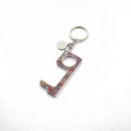 Macro detail of zero-touch acrylic keychain with bohemian pattern on white background - 7# Totem Mandala