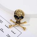 Macro shot of vintage gold skull crossbones brooch with dark punk distressed texture - 5# Vintage Gold Pirate Crossbones