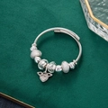 Silver beaded charm bracelet with angel wings heart pendant on adjustable steel wire - Angel