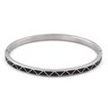 Macro detail of silver stainless steel bangle with black enamel triangle geometric pattern - Steel Black