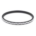 Macro detail of 4mm stainless steel bangle with black and white enamel geometric triangles - Black and White