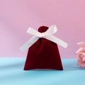 Dark red velvet jewelry pouch with white ribbon bow on pastel background - Burgundy And White Ribbon; 10*12
