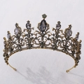Macro detail of a baroque gold crown with dark rhinestones on marble background - Antique Gold + Black Rhinestone