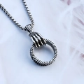 Silver skeleton hand claw pendant holding a textured ring on a steel box chain - Hand Clasping Ring + Steel Chain